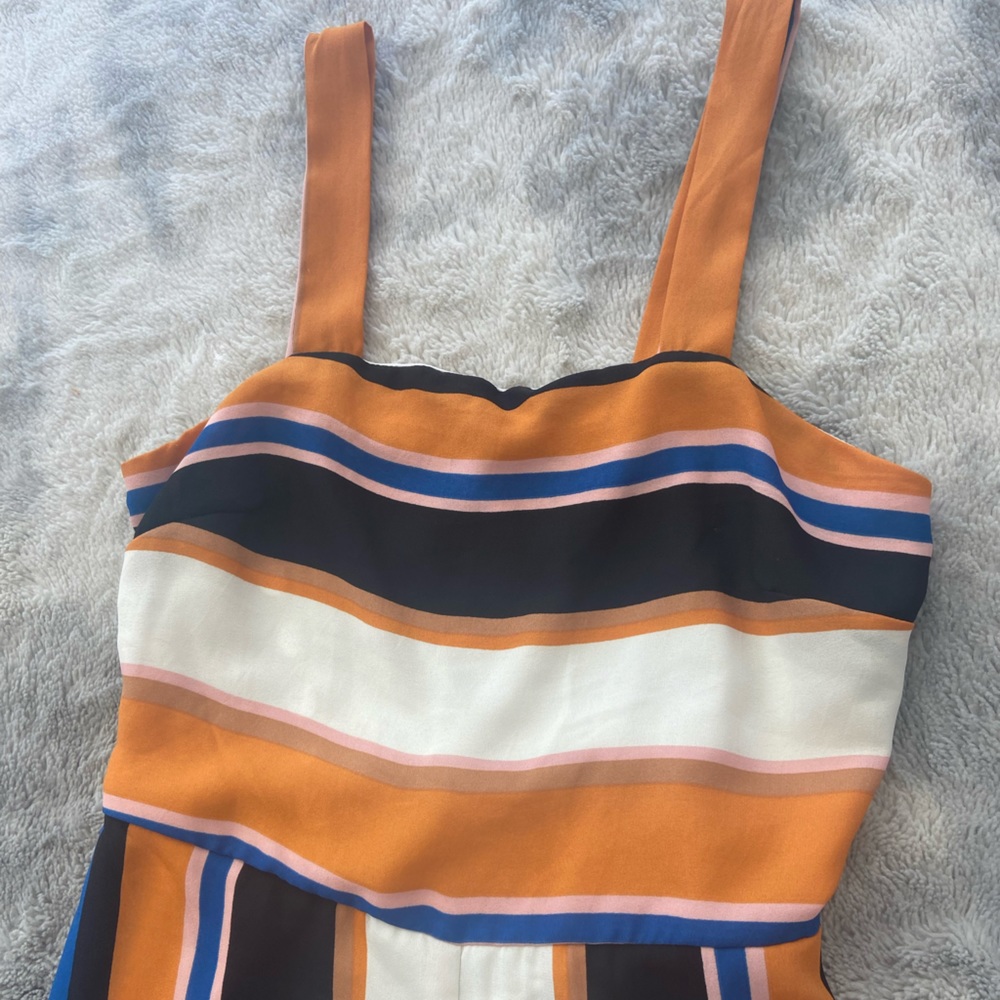 Striped jumpsuit orange blue white and black
